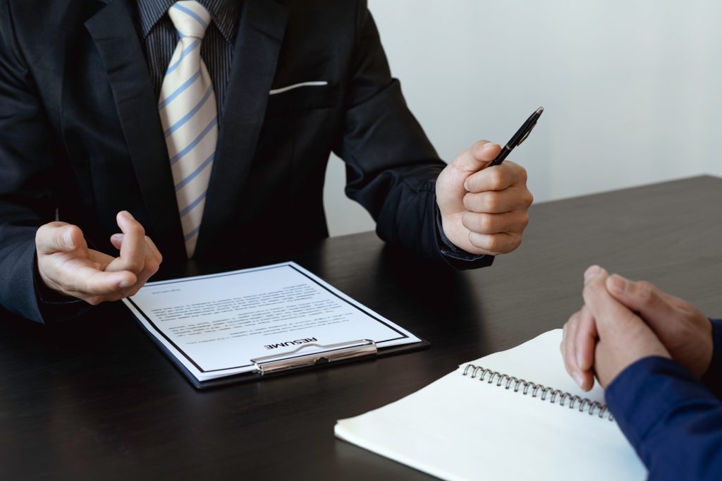 Close up interviewer interview candidate apply for a job at the meeting room in the office. Image of